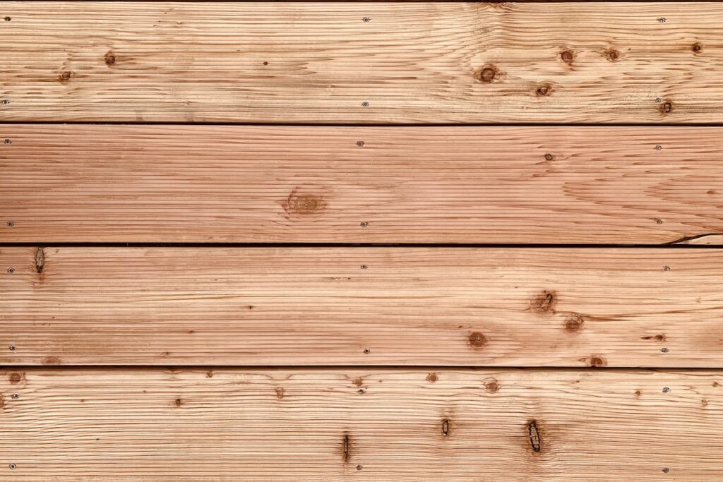 brown wooden plank with white and black paint